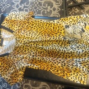 Baby Phat size XS scrub top. Has been gently worn